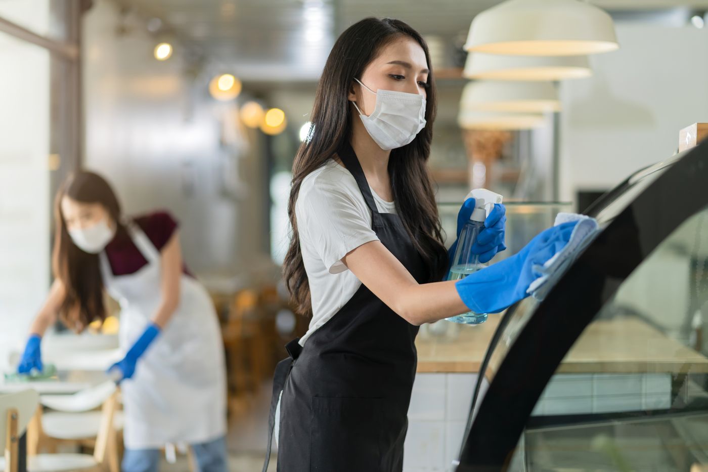 Cleaner preparing an Airbnb property between guests